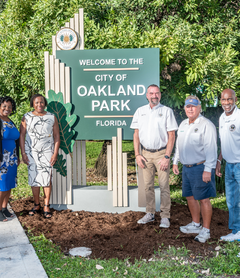 Photo of City Commission at new entry way sign