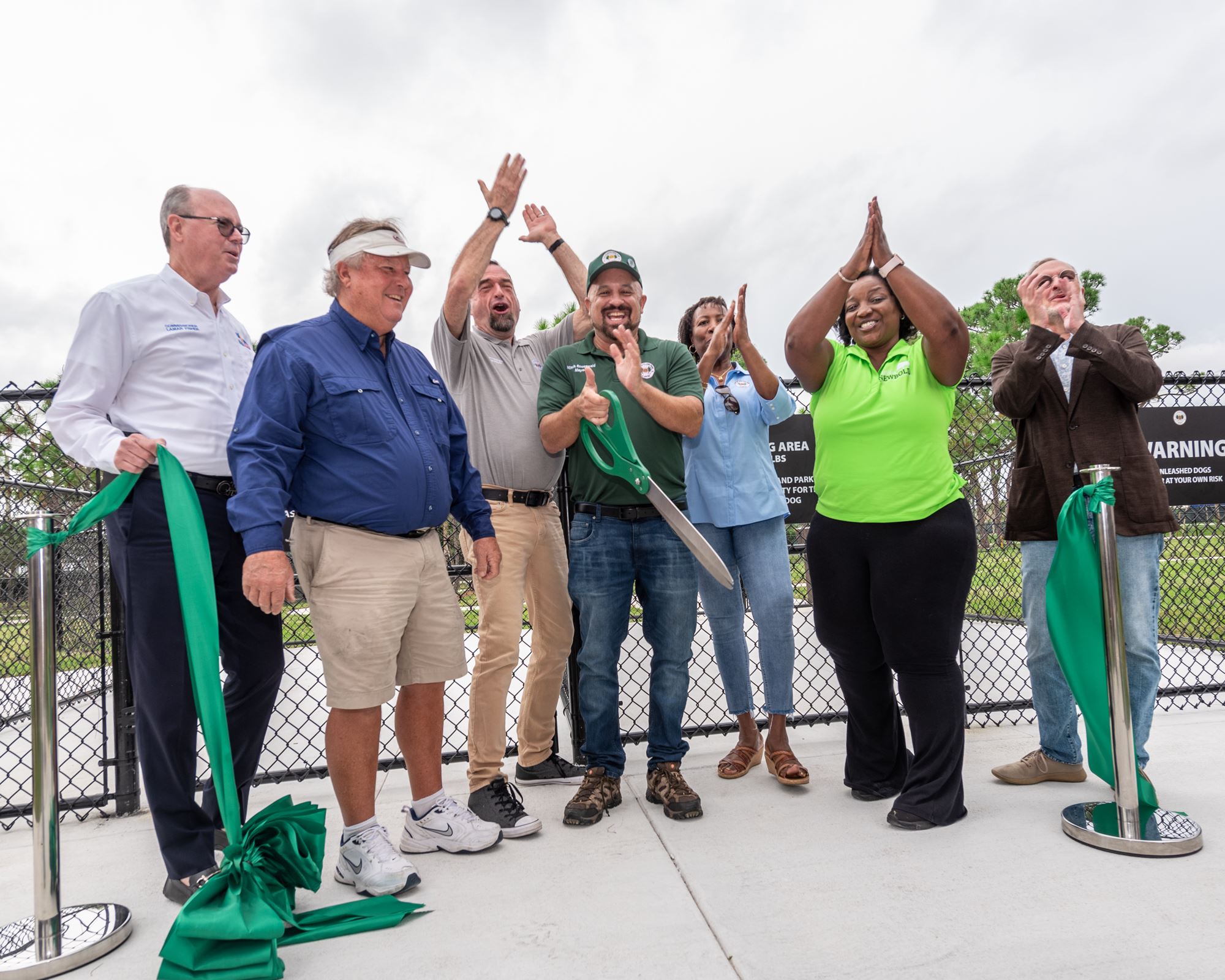 Photo of elected officials cutting the ribbon to open Wag Dog Park 